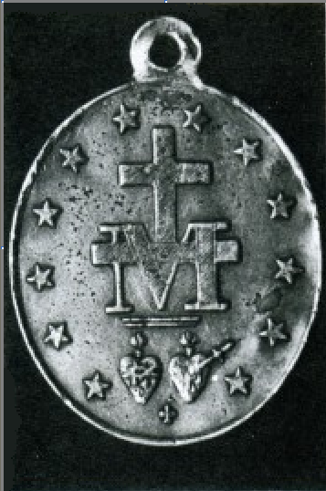 envers grossi de la première frappe de la médaille miraculeuse en 1832 de chez Vachette